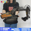 A person holds a YIGONG remote control excavator toy with a tracked body and hydraulic arm.