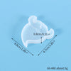 A clear silicone mold shaped like a festive Christmas ornament for jewelry and craft projects.