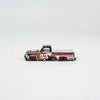 A die-cast model of a Chevrolet Silverado truck in a custom paint scheme with the number 33.