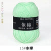 A ball of light green milk cotton yarn labeled with Chinese characters and the size 15# is shown.