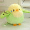 A fluffy, light green cartoon bird plush with orange feet and a yellow beak.