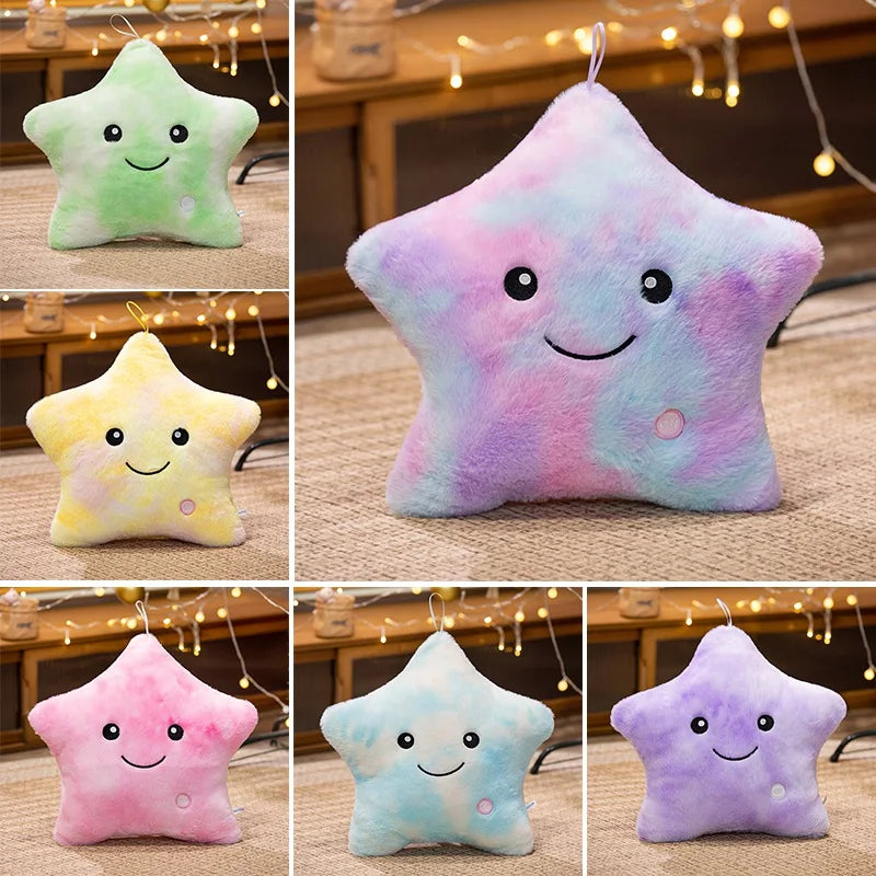 A collection of five star-shaped plush pillows in various pastel colors including green, purple, yellow, and pink.