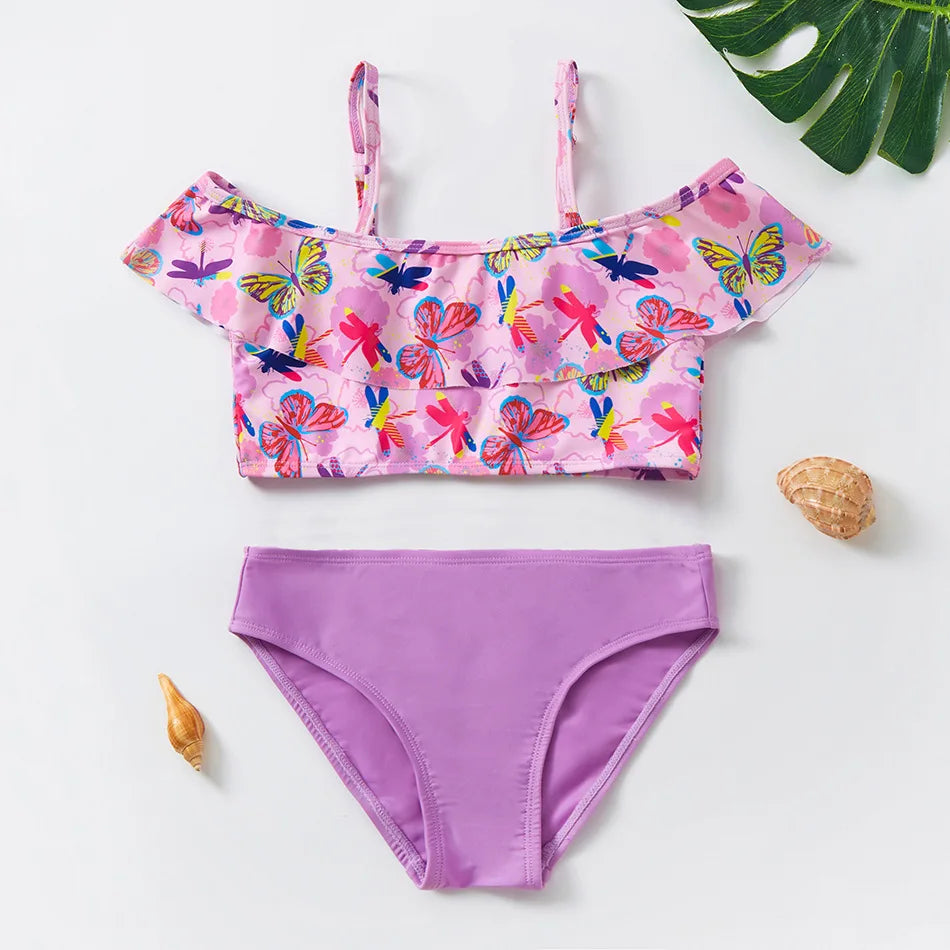 A pink and purple two-piece swimsuit set for girls featuring floral patterns
