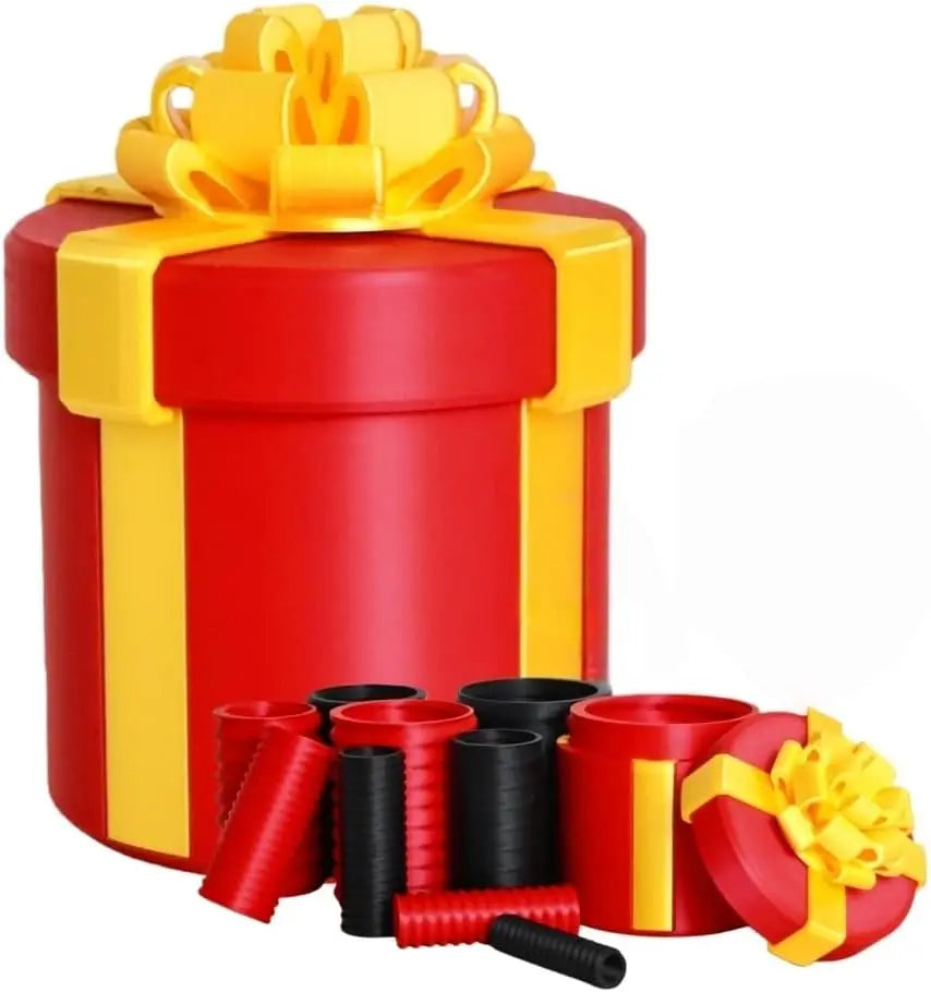 A red gift box with a yellow ribbon and gold bow, surrounded by several nested black and red screw-top boxes.