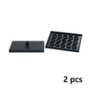 A set of two black motor and servo components for building blocks.