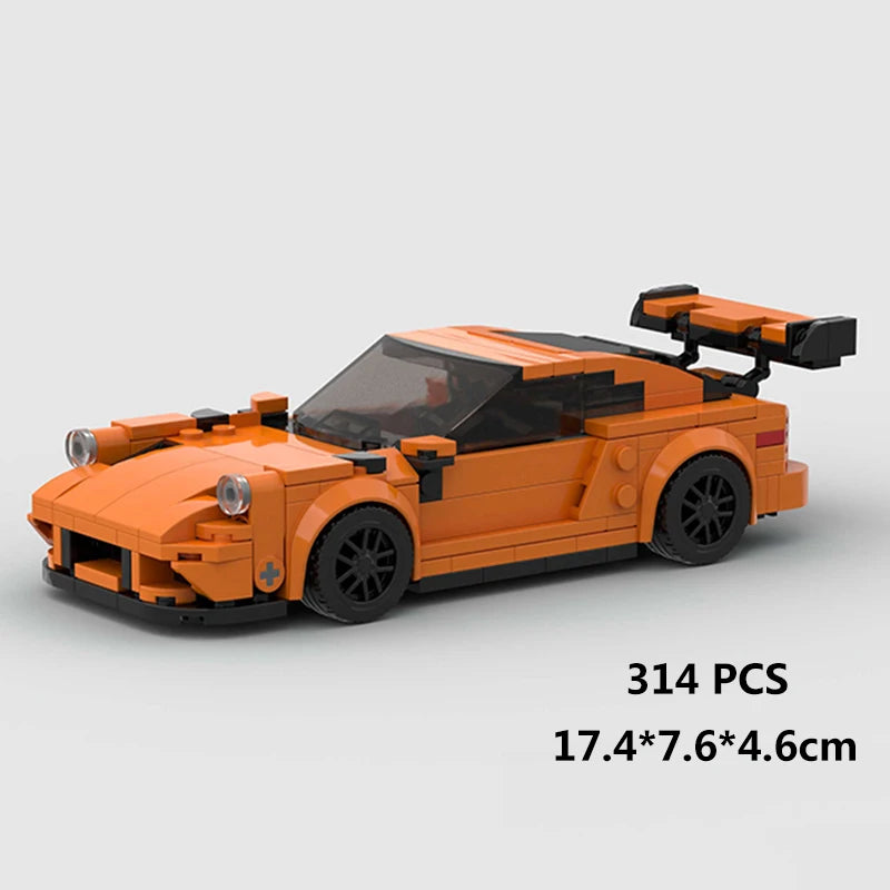 An orange classic rally car building block set with a spoiler and transparent roof.