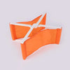 Orange foldable camp pillow with a white strap, shown flat.