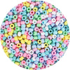 A circular arrangement of multicolor pony beads in various shades of pink, blue, green, and yellow.