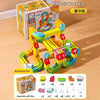 A yellow and green magnetic track car set with various accessories displayed next to its original box.