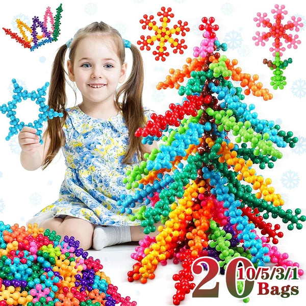 A young girl is sitting next to a large pile of colorful plastic building blocks and bags.