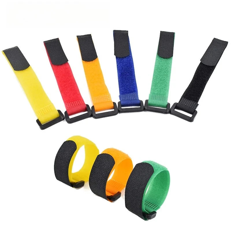 A set of five nylon bike handlebar straps in various colors including yellow, red, orange, blue, and green.