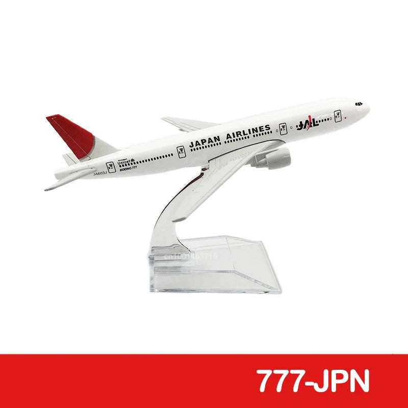 A white diecast model of a Japan Airlines airplane in flight.