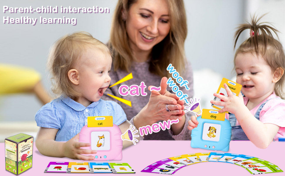 A parent and child interact with a talking flash card toy featuring cat and dog sounds.