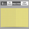 A sheet of round, light yellow self-adhesive dot labels with a grid pattern.