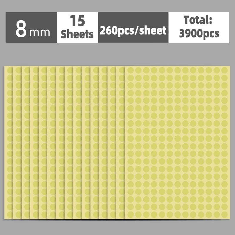A sheet of round, light yellow self-adhesive dot labels with a grid pattern.