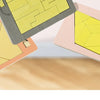 Three wooden geometric brain teaser puzzles of varying sizes and colors are shown in an overhead view.