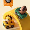 A green animal car toy is shown driving on a yellow push-and-go vehicle, with a soft rubber tire icon nearby.