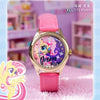A pink strap watch with a gold casing and a purple dial featuring a unicorn design.