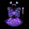 A glowing LED butterfly costume set for girls featuring wings, a wand, and a purple tulle skirt.