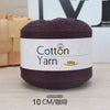A ball of dark brown 100% cotton yarn labeled Cotton Yarn with a 100g weight.