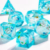 A collection of bright blue liquid core polyhedral dice showing various numbers and a galaxy finish.