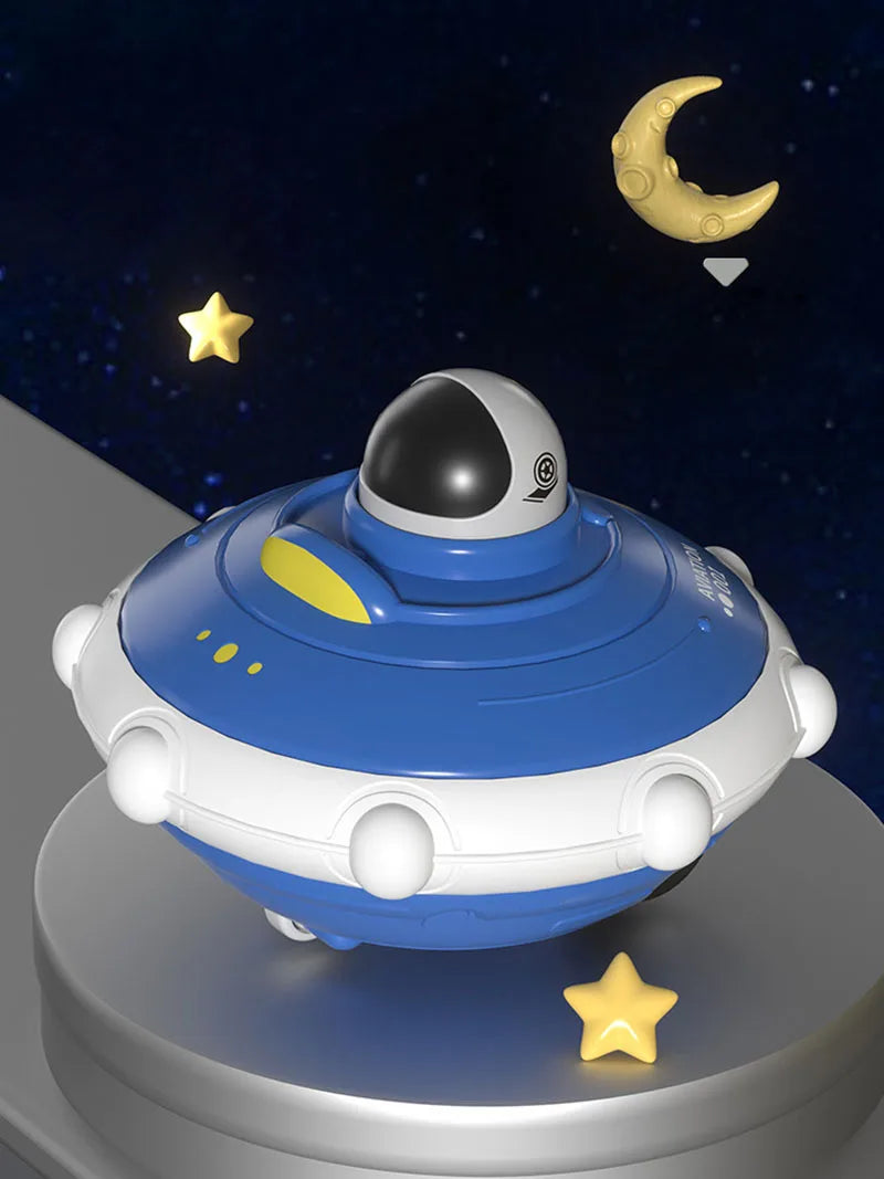 A blue and white soft rubber pull-back toy car is shown against a dark background with a crescent moon and stars.