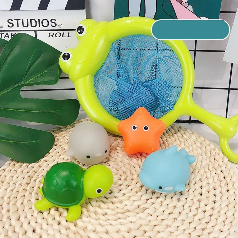 A yellow light-up bath toy set featuring a large, bright green plastic frog and several small, colorful aquatic toys on a wov