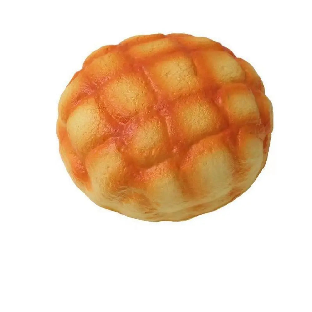 A round, orange-colored bread squeeze toy with a textured surface.