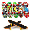 A collection of nine mini finger skateboards in various colors and designs for trick practice.