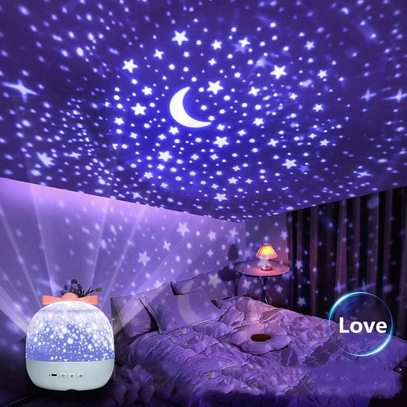 A purple starry sky projector night light illuminates a bedroom with a crescent moon and stars.