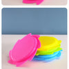 A stack of bright pink and yellow silicone splash flying rings used for water play.