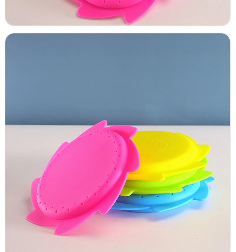 A stack of bright pink and yellow silicone splash flying rings used for water play.