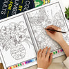 A hand is coloring a page from a color by number book featuring floral and mandala designs.