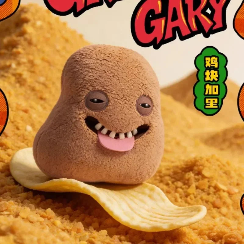 A fluffy, brown monster plush toy shaped like a fried chicken nugget is lying on a golden surface.