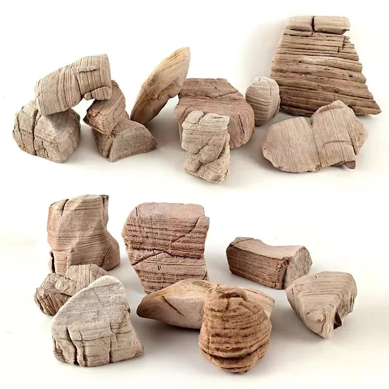 A collection of irregularly shaped, light brown natural microporous aquarium stones for planted tanks.