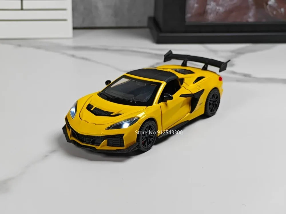 A yellow 1:32 scale diecast supercar model with a black spoiler and opening doors on a white marble surface.