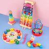 A wooden puzzle set featuring colorful stacking blocks, a wooden tower, and various shaped wooden pieces for early learning.