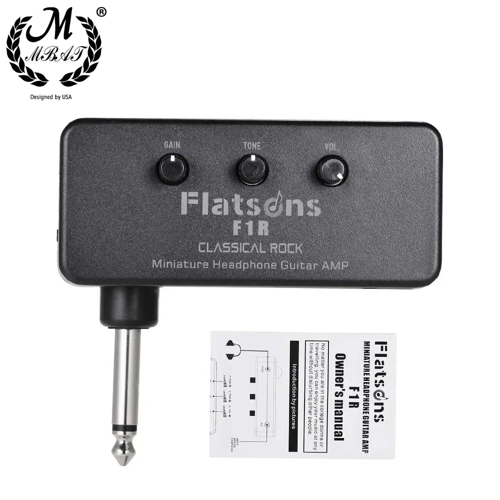 A black Flatsons F1R miniature headphone guitar amp with gain, tone, and volume controls.