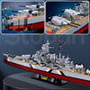 A detailed model kit of the Bismarck Battleship shown in various views, including a full scale representation.