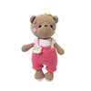 Handmade crochet stuffed bear with light brown fur wearing a pink dress and white apron