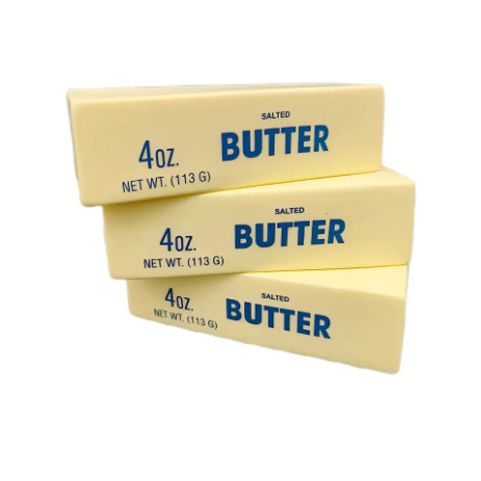 Three rectangular blocks of salted butter labeled 4oz butter with net weight 113g