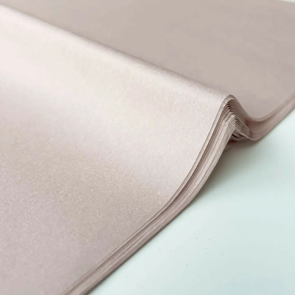 A stack of translucent pink tissue paper sheets for gift wrapping and flower bouquets.
