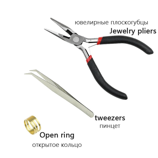 A set of jewelry pliers, tweezers, and an open ring shown on a white background.