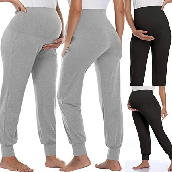 A woman models high-waist stretch maternity joggers in gray and black.