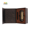 A dark brown metal cryptex lock featuring rings, displayed in an open box.