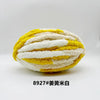 A ball of chunky chenille yarn featuring alternating stripes of bright yellow and white.