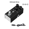 A black Ultimate Drive pedal with various knobs and an output jack, along with a cable.