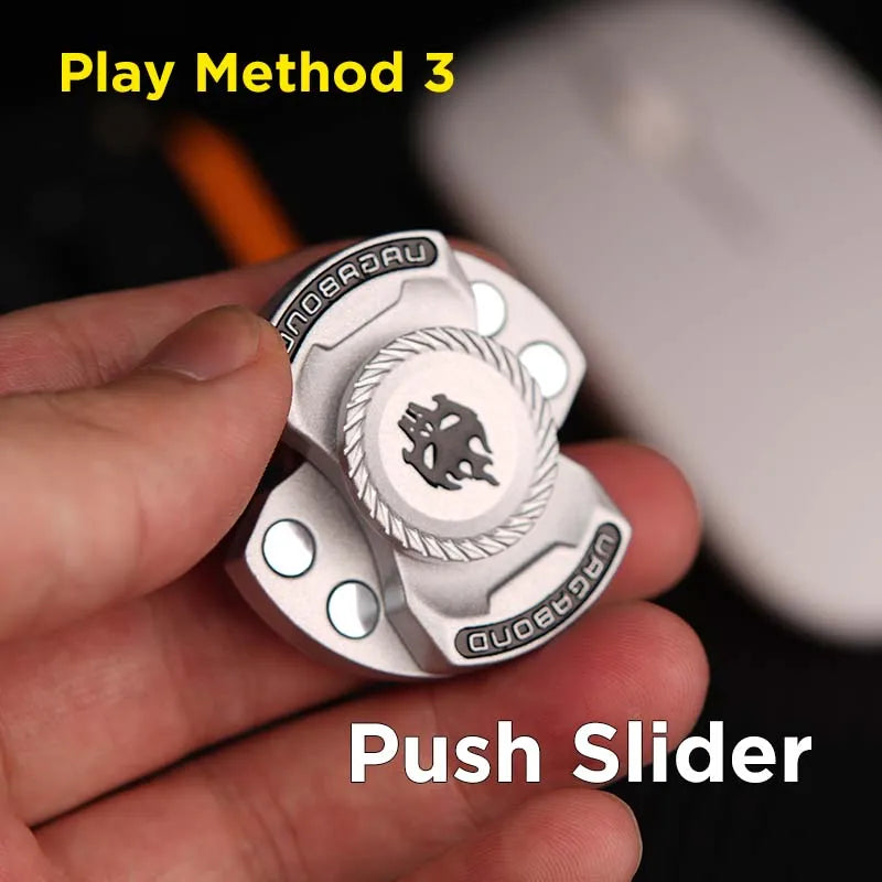 A hand holds a silver magnetic fidget spinner with push sliders, demonstrating Play Method 3.