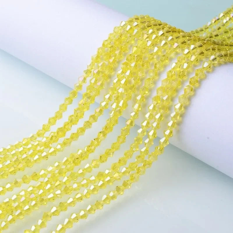 Yellow faceted glass crystal beads strung together for jewelry making