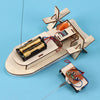 A wooden paddle boat model kit with a solar-powered motor and various components for a DIY science project.